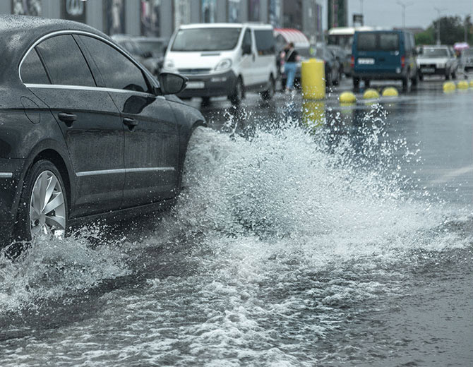 Car driving through flooded road